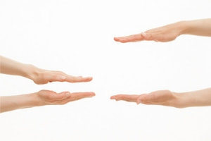 Hands reaching out towards each other, symbolizing connection and collaboration, relevant to Lodder Brothers Limited's customer service approach in plumbing and heating solutions.