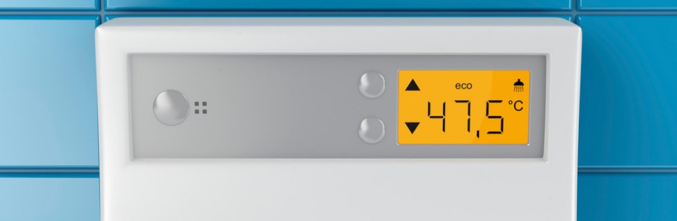 Digital display of a tankless water heater showing temperature setting at 47.5°C, emphasizing modern water heating technology and efficiency.