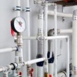 PVC plumbing system with pressure gauge and fittings by Lodder Brothers Limited, showcasing repiping options.
