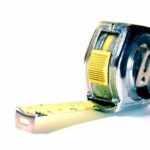 Retractable measuring tape showing measurements, ideal for selecting toilets with Lodder Brothers plumbing services.